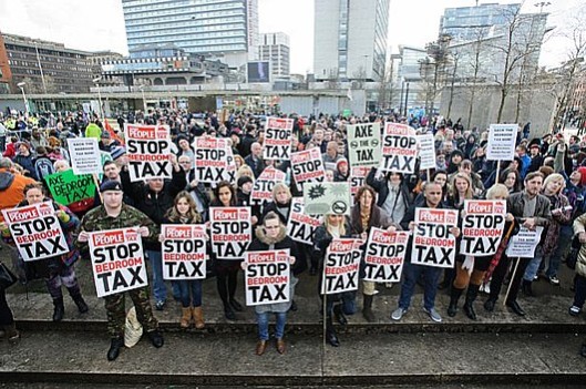 Falling on deaf ears: The chorus of protest against the bedroom tax is unlikely to be heard at the Conservative Party Conference in Manchester, where delegates will be discussing how to bribe the electorate into supporting them in 2015. [Picture: Matthew Pover in the Sunday People]